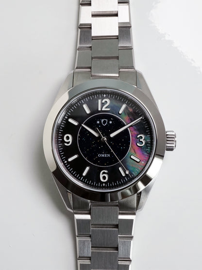 Silver watch with a black face on a white background