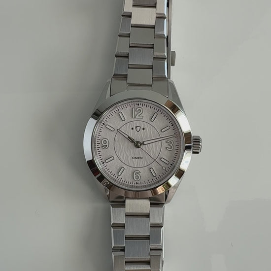 demonstration of silver watch with white face